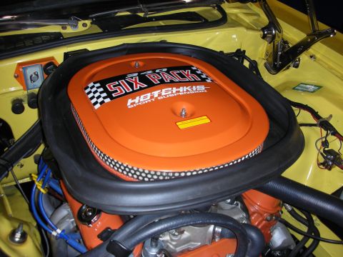 1998 Ford Crown Victoria - Close-up of a Six Pack air cleaner assembly in a yellow engine bay.