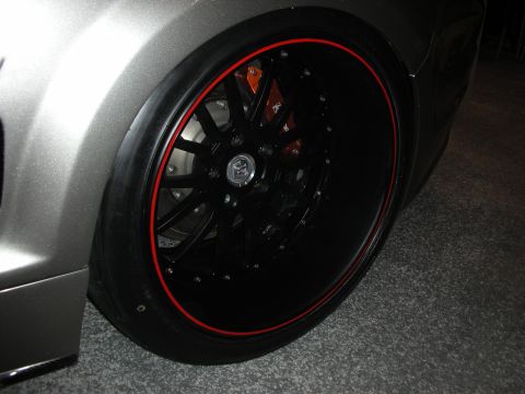 1998 Ford Crown Victoria - Custom wheel and brake caliper detail on a vehicle.