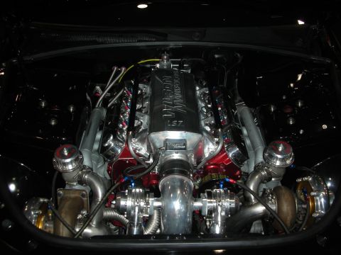 1998 Ford Crown Victoria - Custom twin-turbocharged V8 engine with prominent Wilson Manifolds intake and dual turbochargers.
