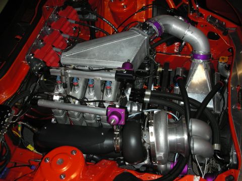 1998 Ford Crown Victoria - Customized engine bay with a large turbocharger and intercooler system.