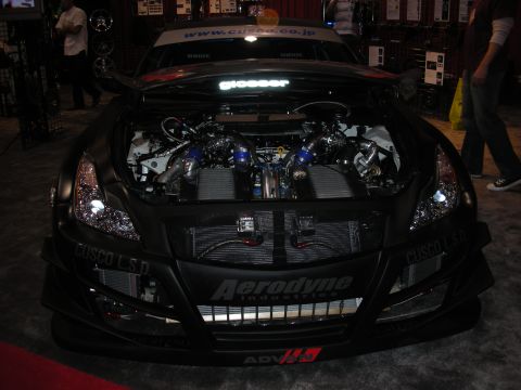 1998 Ford Crown Victoria - Car with hood open showing a heavily modified engine bay with twin turbos and intercoolers.
