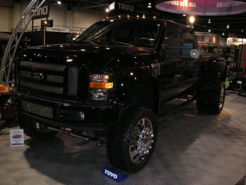 1998 Ford Crown Victoria - This black Ford F-350 Super Duty dually truck has a custom grille and chrome wheels.