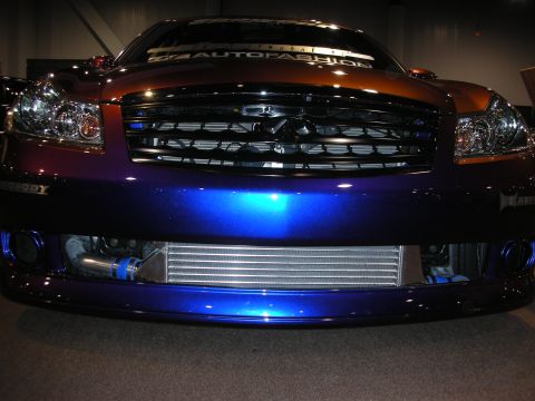 1998 Ford Crown Victoria - Front view of a custom Infiniti sedan with a unique paint job and visible intercooler.