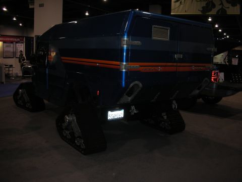 1998 Ford Crown Victoria - This custom vehicle features a van body mounted on tracks for off-road capability.