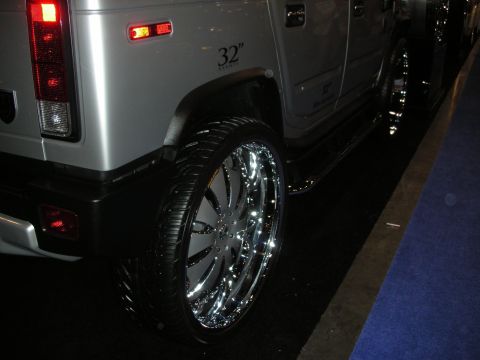 1998 Ford Crown Victoria - This Hummer H2 features custom 32-inch chrome wheels and a silver paint job.