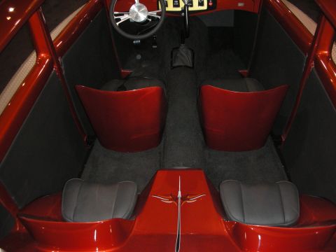 1998 Ford Crown Victoria - Interior view of a custom hot rod, red seats and a unique center console with pinstriping.