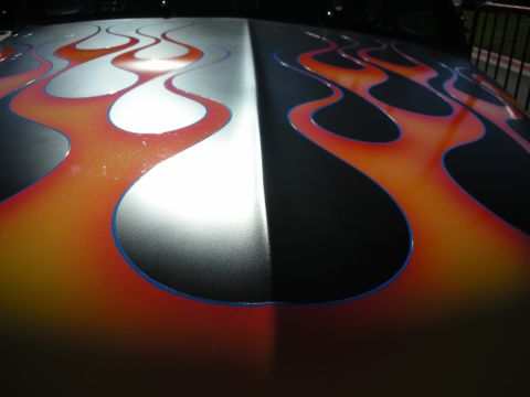 1998 Ford Crown Victoria - Car hood displays a custom flame paint job with a split silver and black design.
