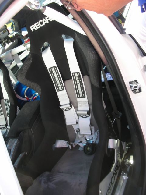 1998 Ford Crown Victoria - Interior view of racing seats and harnesses, suggesting a modified vehicle.
