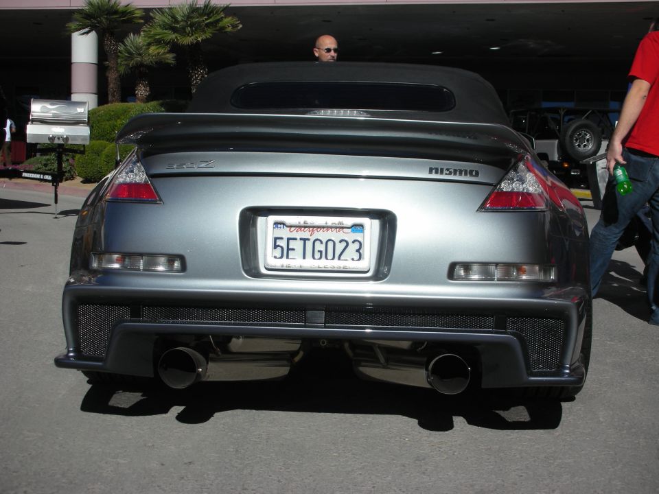 Nissan 350Z convertible with Nismo badging and aftermarket exhaust. California license plate 5ETG023