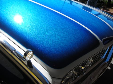1998 Ford Crown Victoria - Car hood displays custom blue metallic paint with white racing stripes and chrome trim.
