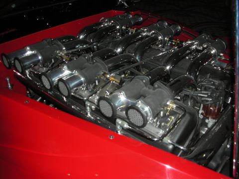 1998 Ford Crown Victoria - This V12 engine features a complex intake system with numerous chrome-plated runners and individual carburetors.
