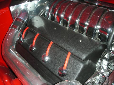 1998 Ford Crown Victoria - Custom engine bay features polished chrome and red spark plug wires against a black cover.