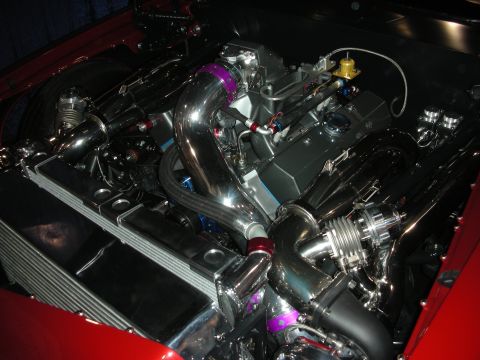 1998 Ford Crown Victoria - Customized engine bay with polished chrome components and a turbocharger system.