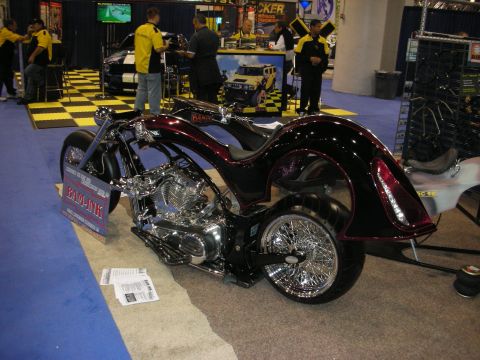 1998 Ford Crown Victoria - Custom motorcycle on display at an event, with a sign indicating it is called 'BAD-LINK'.