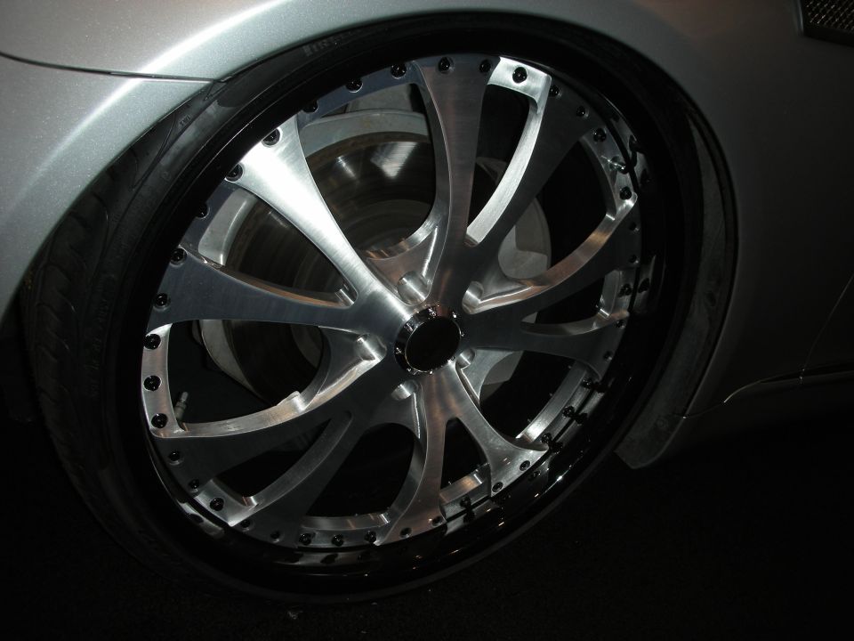 Silver car with custom chrome wheel and tire