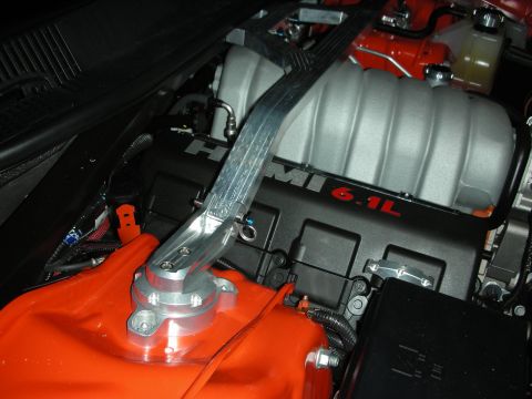 1998 Ford Crown Victoria - Close-up of an engine bay a HEMI 6.1L engine and an aftermarket strut tower brace.