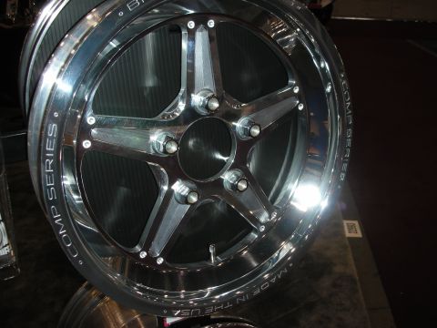 1998 Ford Crown Victoria - Close-up of a chrome custom wheel, labeled "COMP SERIES" and "MADE IN THE USA".