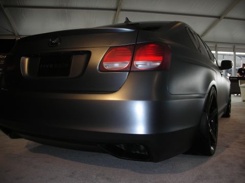 1998 Ford Crown Victoria - Matte gray Lexus GS sedan with aftermarket wheels and tinted windows is shown from the rear quarter angle.