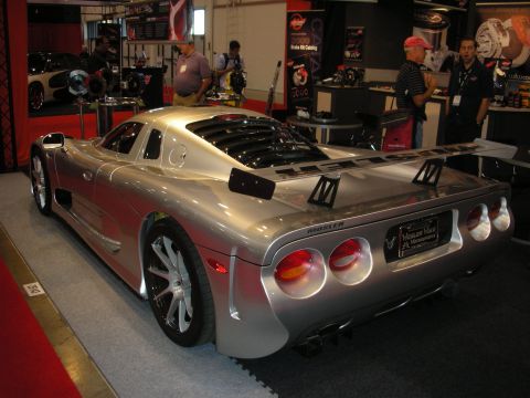 1998 Ford Crown Victoria - Rear view of a silver Mosler sports car at an indoor event.