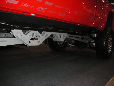 1998 Ford Crown Victoria - Close-up view of a modified truck's undercarriage, highlighting its custom suspension system.
