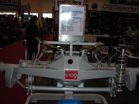 1998 Ford Crown Victoria - A rear axle assembly with visible Chassisworks FAB9 branding is displayed at an automotive show.