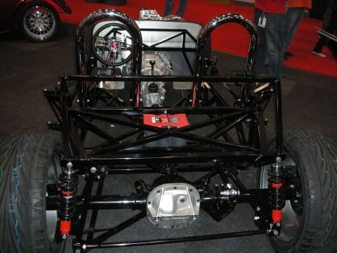 1998 Ford Crown Victoria - This custom hot rod chassis features a bare frame with exposed mechanical components and a roll cage.