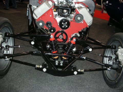 1998 Ford Crown Victoria - Close-up view of a custom vehicle's front suspension and engine assembly.