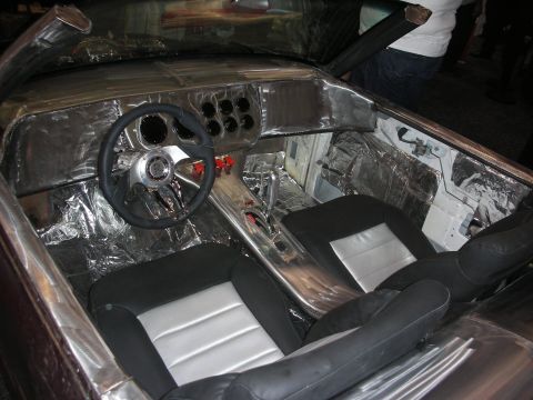 1998 Ford Crown Victoria - Interior view of a heavily modified vehicle aluminum paneling and custom seats.