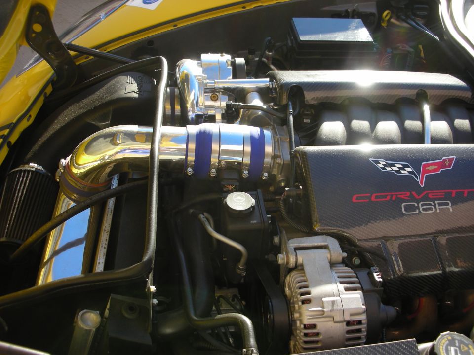 Corvette C6R engine bay with chrome piping and carbon fiber accents