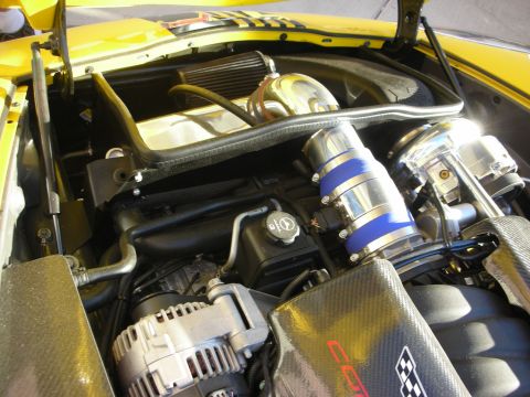 1998 Ford Crown Victoria - Close-up of a modified engine bay with custom turbo and intake components visible.