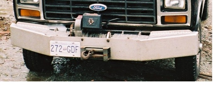Two storage compartments, one on either side of the winch, for whatever. Wingnuts keep closed while bouncing around.