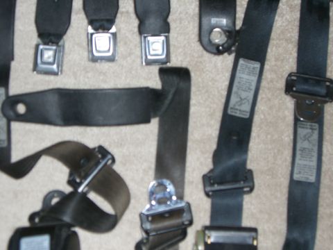 1988 Ford Bronco - Multiple seat belts are shown, some with metal buckles and others with fabric straps.