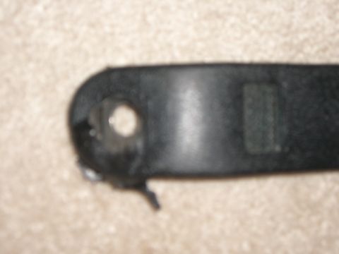 1988 Ford Bronco - Close-up of a black plastic automotive part, possibly a trim piece, with visible mounting holes and a Supermotors.net watermark.