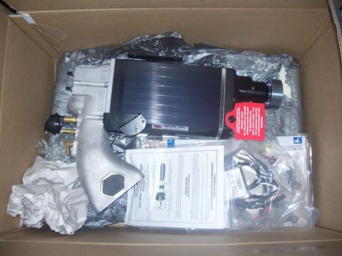 2007 Ford Mustang - A new automotive part is shown inside its shipping box with installation instructions.