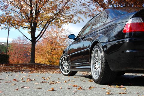 2002 BMW M3 - A black 2002 BMW M3 coupe is seen from the rear quarter angle during an autumn photoshoot.