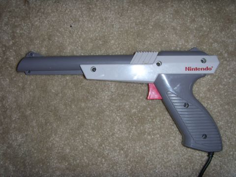 1978 Ford Bronco - A Nintendo Zapper light gun is shown on a carpeted surface.