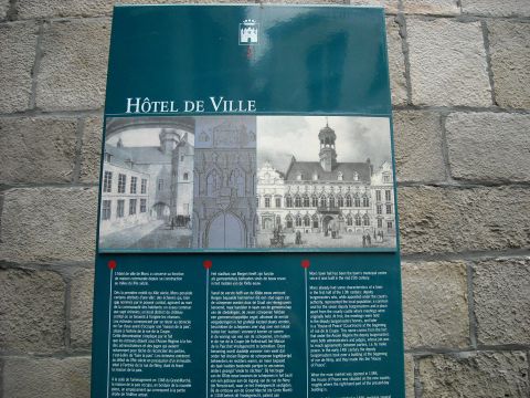1979 Ford F-150 - A sign displays historical drawings and text about the Hôtel de Ville, likely a town hall, with French and English descriptions.
