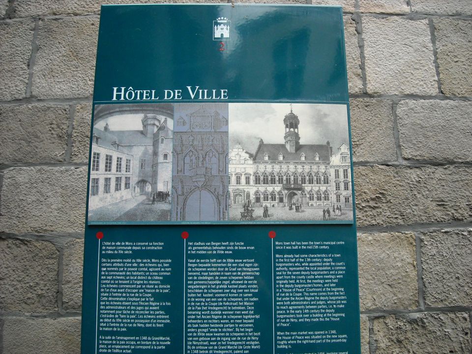 Tourist information panel titled Hotel de Ville with engravings and bilingual text