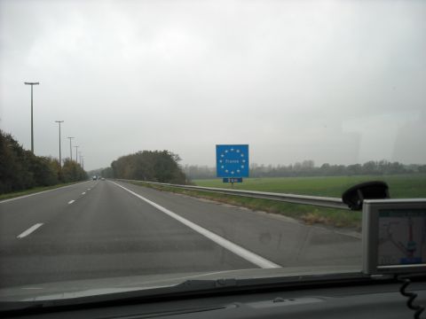 1979 Ford F-150 - Approaching the border into France on a highway, with a GPS unit mounted on the dashboard.