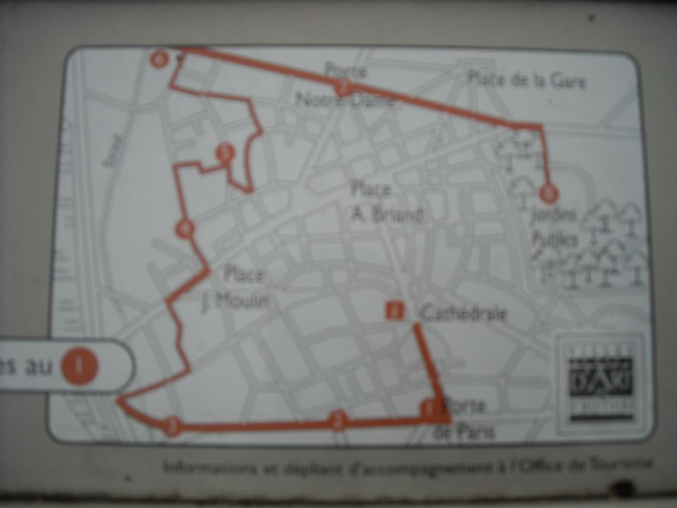 Photo of a tourist walking-route map sign showing a town center