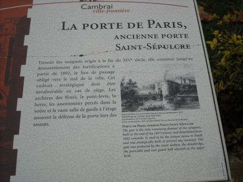 1979 Ford F-150 - A sign in French and English describes the history and features of the Porte de Paris, also known as the Porte Saint-Sépulcre, in Cambrai.