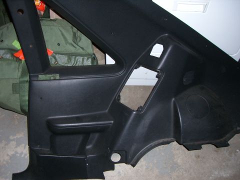 1988 Ford Bronco - Interior trim panel from a vehicle, likely a door panel or rear quarter panel.