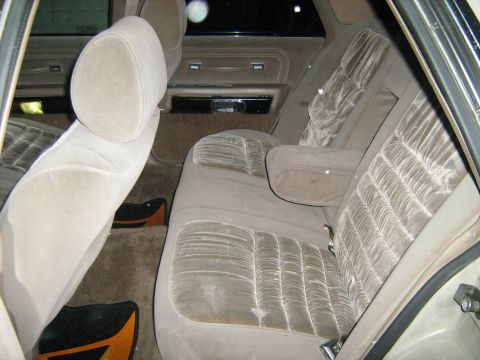 1988 Mercury Grand Marquis - Interior view of a car's velour seats and door panels.