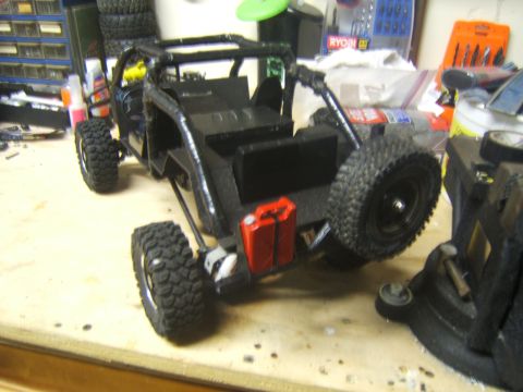 1988 Ford Bronco - This is a remote-controlled rock crawler buggy with a detailed interior and exterior, including a spare tire and fuel cans.