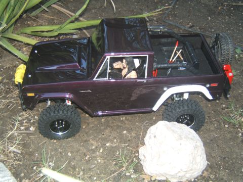 1988 Ford Bronco - This 1988 Ford Bronco RC crawler features a deep purple paint job and a spare tire mounted on the back.
