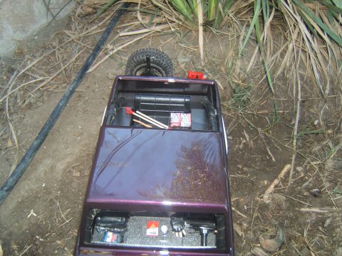 1988 Ford Bronco - Remote control car interior shows battery packs and some matches. Year is not discernible.