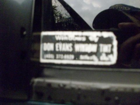 1995 GMC Sierra 1500 - A sticker for Don Evans Window Tint is visible on the side of a vehicle.