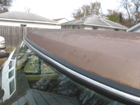 1978 Ford F-250 - Close-up view of a weathered truck roof showing signs of rust and wear.