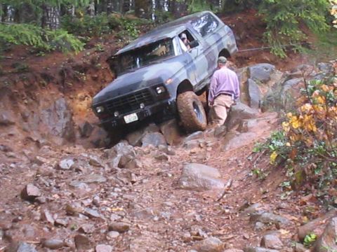 1989 Ford Bronco - This Ford Bronco is navigating a challenging rocky terrain.