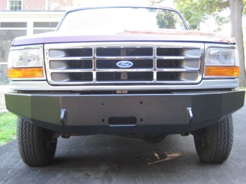 1996 Ford Bronco - Front view of a 1996 Ford Bronco, its distinctive grille and a heavy-duty aftermarket bumper.